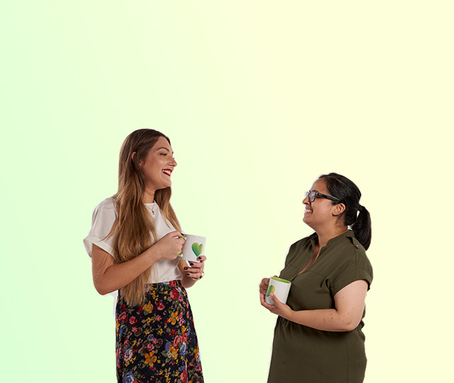 People smiling with a coffee